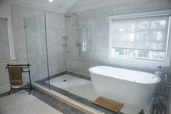 Stone tiled bathroom with Allstone stock Bianco Carrara, London Gray, & Bianco Carrara Adeline Hex